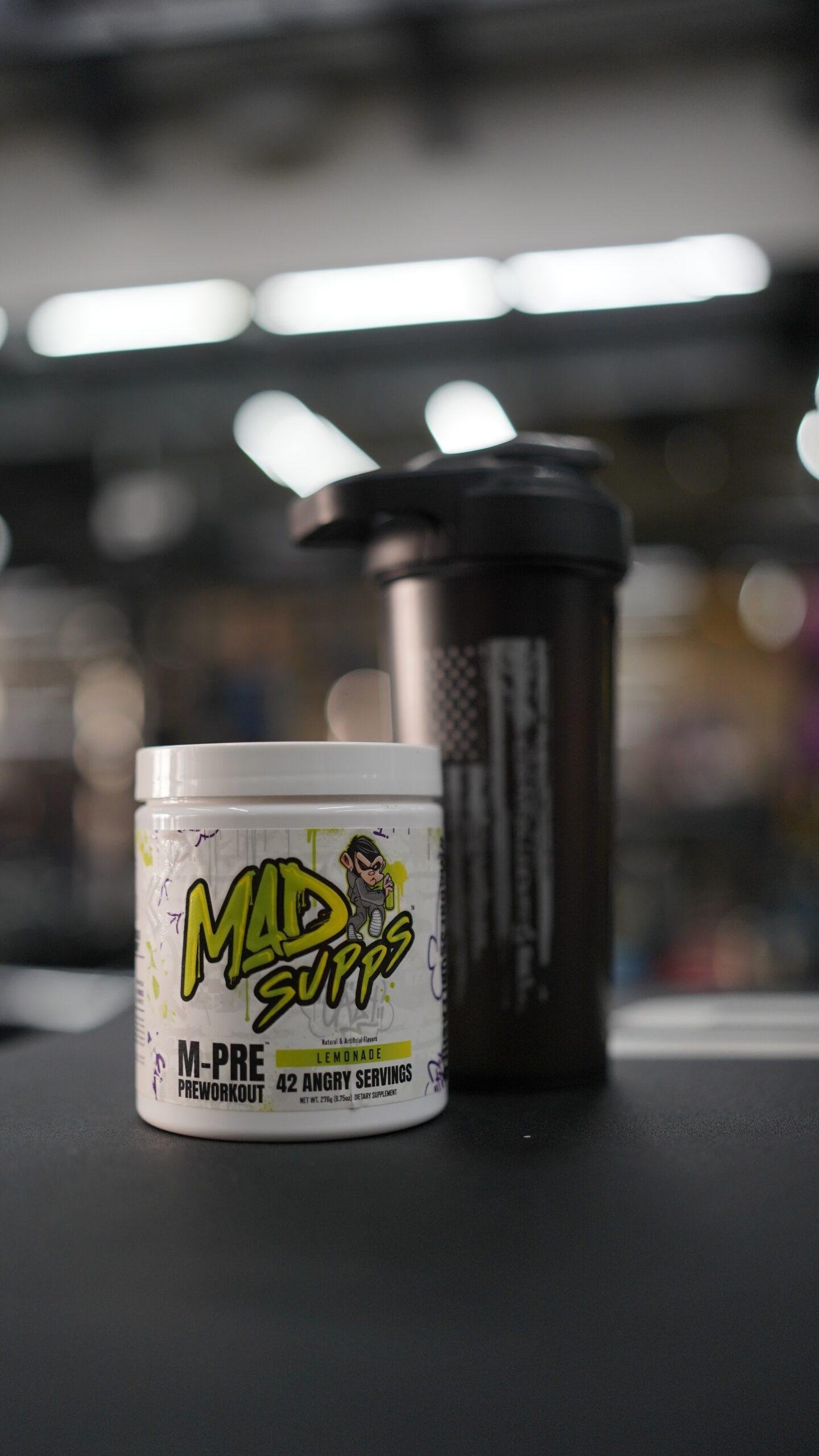 Mad Supps M-pre with a shaker in the gym